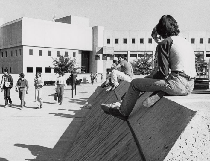 Vintage black and white photo of students on 91's campus