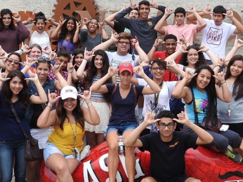 Latino students posing outside of the Cincinnati Reds stadium.